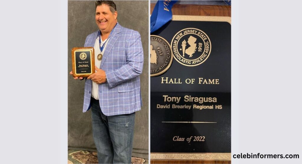 A man proudly displays a plaque and a photo commemorating Tony Siragusa's NFL career achievements.